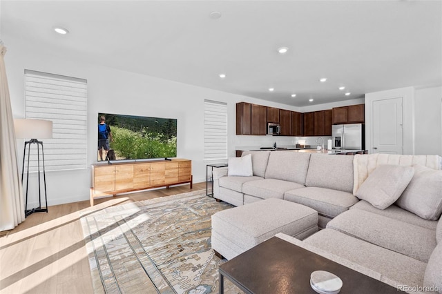 15606 W Girard Ave, Morrison, CO 80465 - living area with light wood-style flooring, baseboards, and recessed lighting