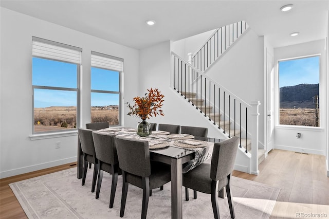 15606 W Girard Ave, Morrison, CO 80465 - dining space with baseboards, stairway, recessed lighting, and light wood-style floors