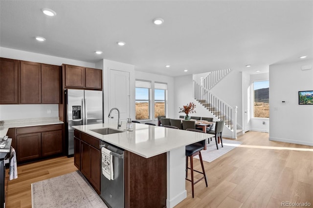 15606 W Girard Ave, Morrison, CO 80465 - kitchen featuring a sink, stainless steel appliances, recessed lighting, and light wood-type flooring