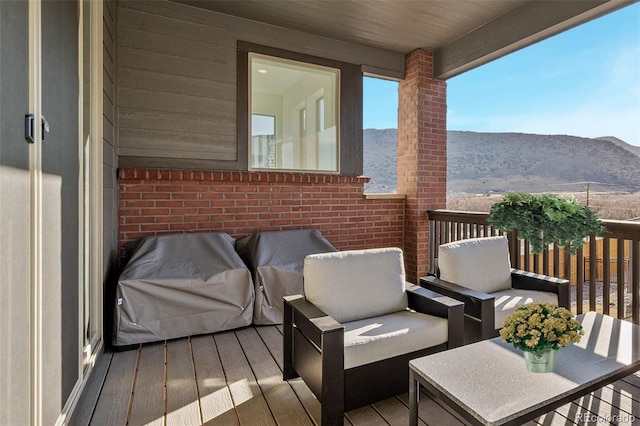 15606 W Girard Ave, Morrison, CO 80465 - wooden deck featuring a mountain view and outdoor lounge area