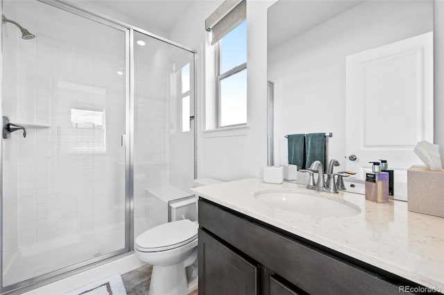 15606 W Girard Ave, Morrison, CO 80465 - bathroom featuring vanity, toilet, and a shower stall