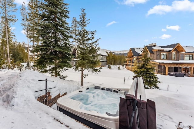 exterior space featuring an outdoor hot tub