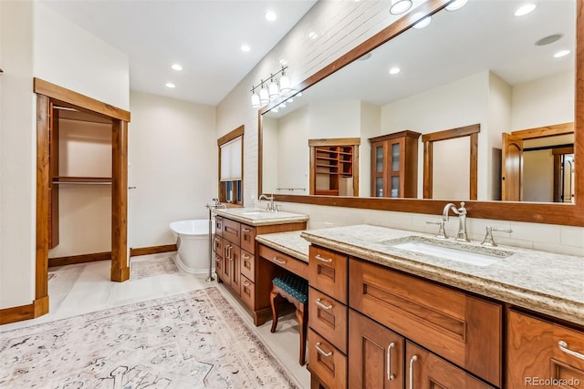 bathroom with vanity and a bathing tub