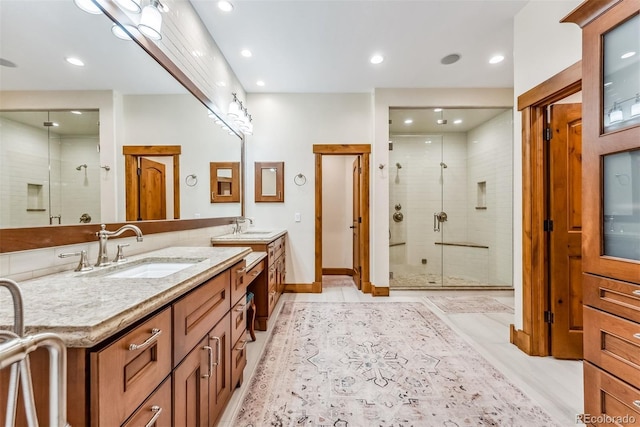 bathroom with an enclosed shower and vanity