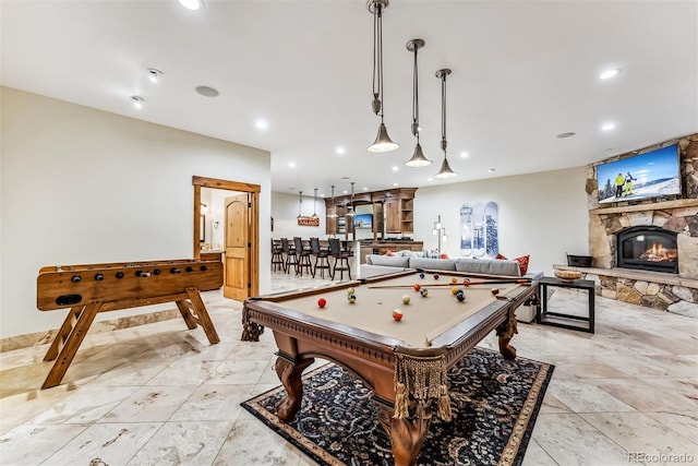 recreation room featuring a fireplace and pool table