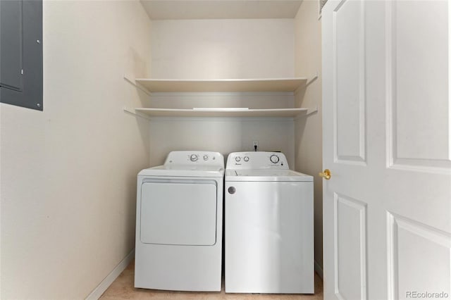 8427 S Hoyt Way Unit 203, Littleton, CO 80128 - washroom with electric panel and washing machine and clothes dryer