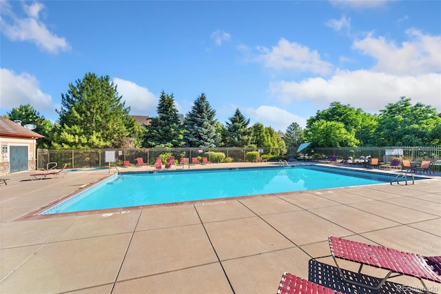 8427 S Hoyt Way Unit 203, Littleton, CO 80128 - community pool with a patio area and view of scattered trees