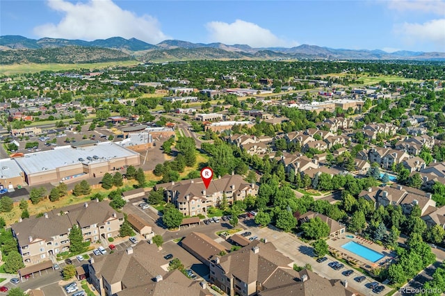 8427 S Hoyt Way Unit 203, Littleton, CO 80128 - aerial view of property's location featuring mountains and nearby suburban area