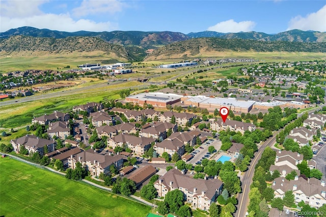8427 S Hoyt Way Unit 203, Littleton, CO 80128 - aerial overview of property's location featuring a mountain backdrop and nearby suburban area