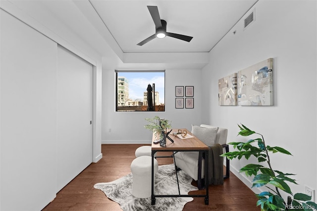 office area with ceiling fan and dark hardwood / wood-style flooring