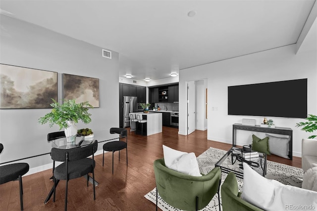 living room with dark hardwood / wood-style floors