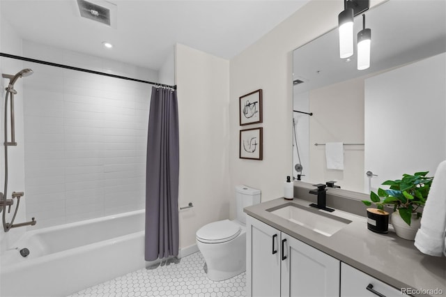 full bathroom featuring shower / bath combo with shower curtain, toilet, tile patterned floors, and vanity