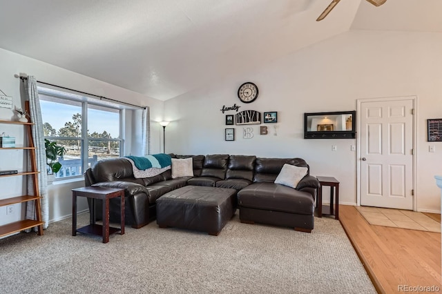 living area with vaulted ceiling, ceiling fan, and wood finished floors