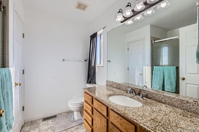 bathroom with toilet, an enclosed shower, visible vents, and vanity