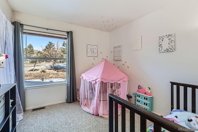 carpeted bedroom with baseboards and visible vents