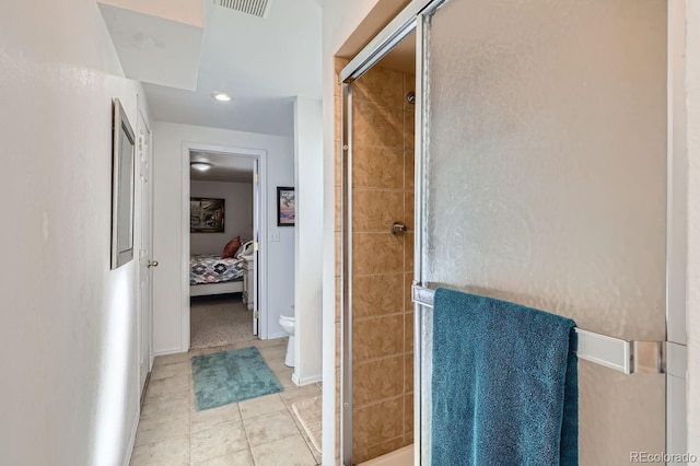 ensuite bathroom featuring toilet, a shower stall, visible vents, and ensuite bathroom