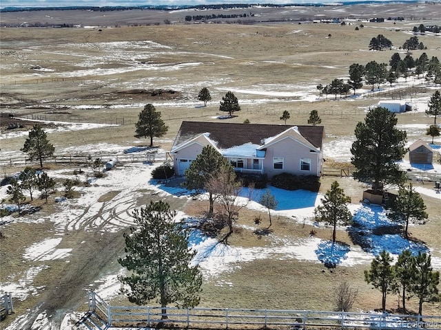 snowy aerial view featuring a rural view