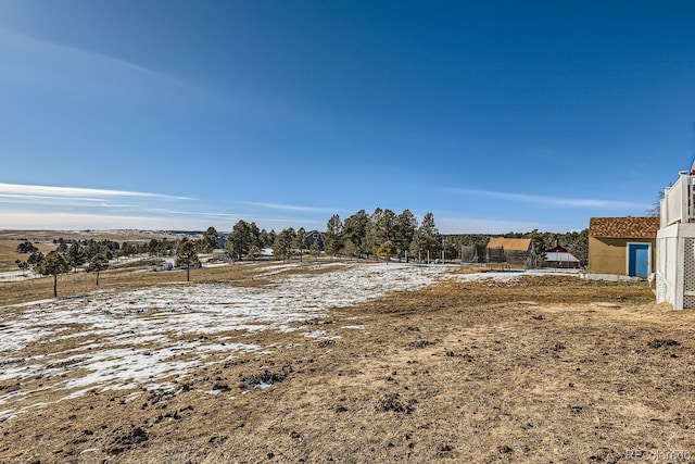 view of yard with a rural view
