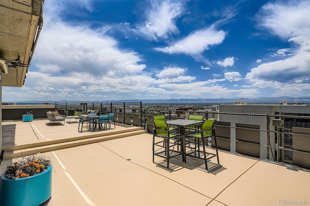 790 N Washington St Unit 1003, Denver, CO 80203 - view of patio featuring outdoor dining space and a mountain view