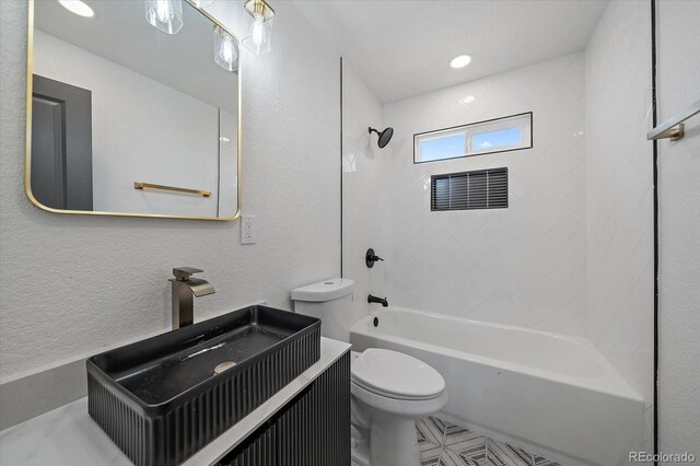 716 S Osage, Denver, CO 80223 - full bathroom with toilet, shower / bath combination, vanity, and a textured wall