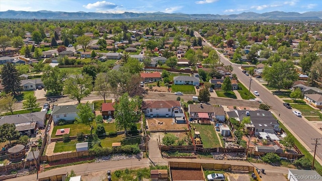 716 S Osage, Denver, CO 80223 - aerial overview of property's location with mountains and nearby suburban area