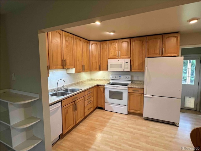 220 Lily Ln, Golden, CO 80403 - kitchen featuring white appliances, light wood-style flooring, light countertops, and backsplash