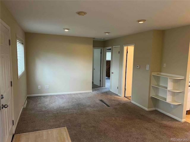 220 Lily Ln, Golden, CO 80403 - unfurnished room featuring plenty of natural light and carpet