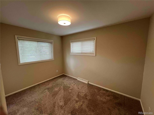 220 Lily Ln, Golden, CO 80403 - unfurnished room with dark colored carpet and baseboards