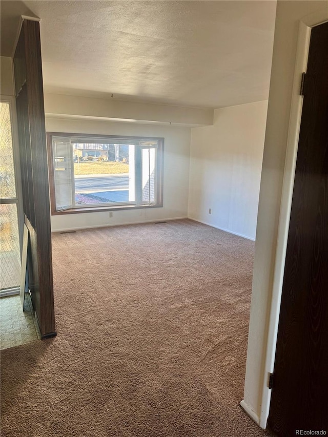 spare room with carpet flooring