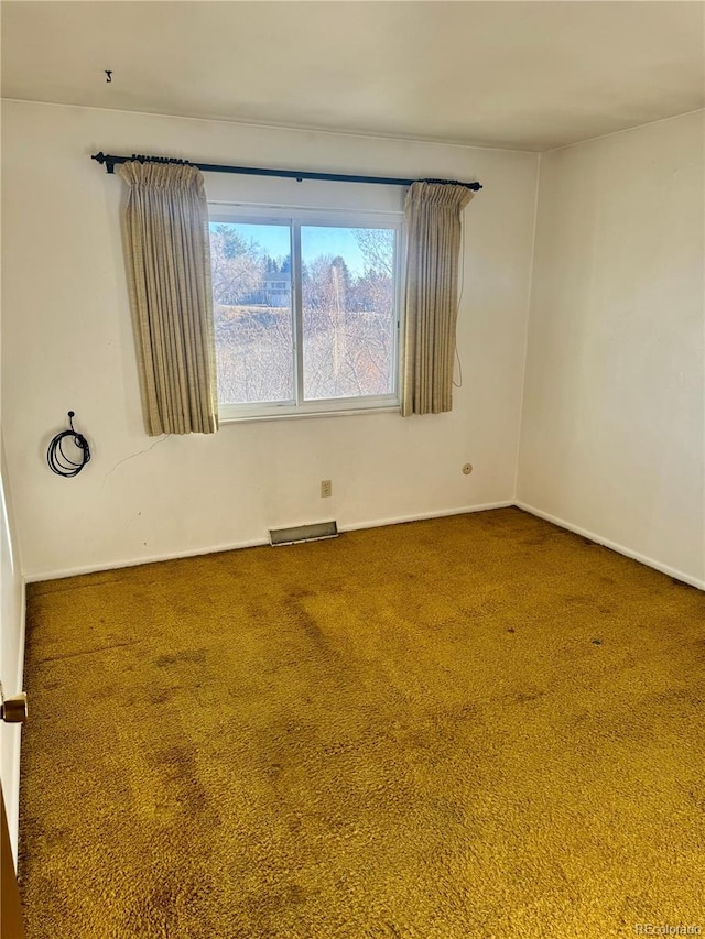 empty room featuring carpet flooring