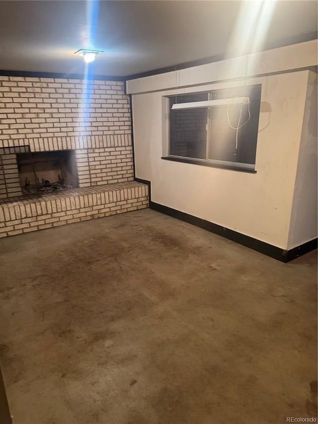 basement with a brick fireplace