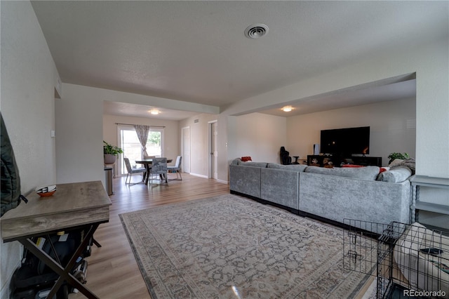 701 Tucson, Aurora, CO 80011 - living area featuring light wood-style floors and baseboards