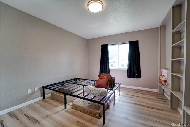 701 Tucson, Aurora, CO 80011 - interior space featuring light wood-type flooring, baseboards, and built in features