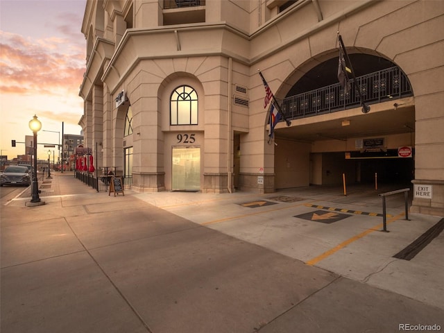 view of exterior entry at dusk