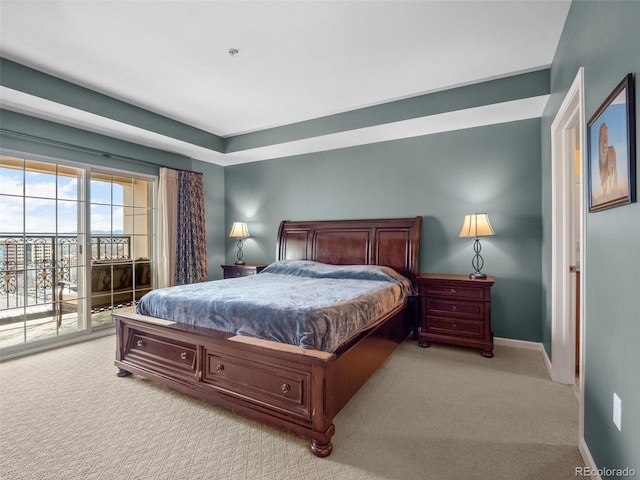 carpeted bedroom with access to outside and baseboards