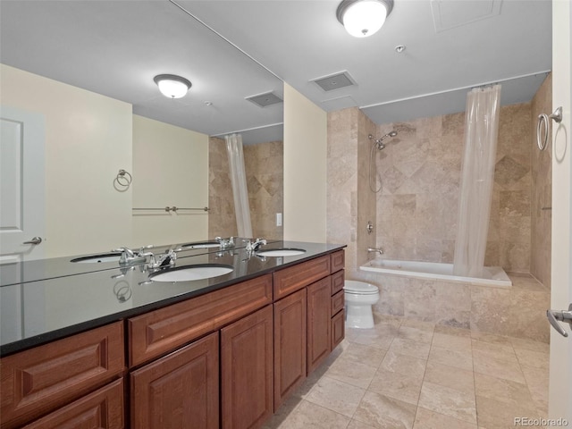 bathroom featuring a sink, visible vents, and tiled shower / bath combo