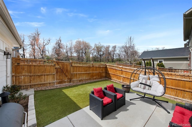 view of patio / terrace with a fenced backyard and a gate