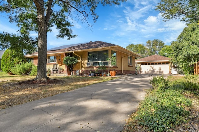 view of front of house featuring a garage and a porch