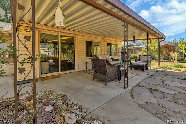 view of patio / terrace featuring fence and an outdoor hangout area