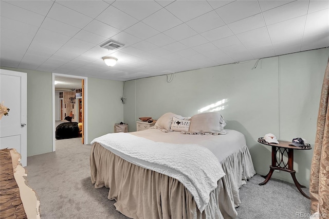 bedroom with visible vents and light colored carpet