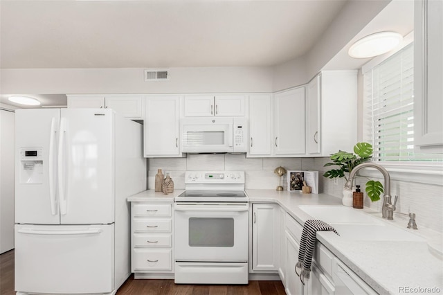 kitchen featuring white cabinets, sink, white appliances, and backsplash