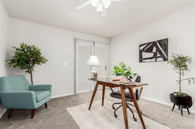 carpeted home office with ceiling fan