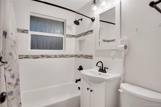 bathroom with shower / bath combination with curtain, vanity, toilet, and tasteful backsplash