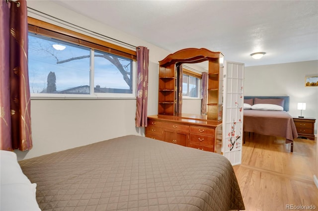 bedroom with light wood-style floors