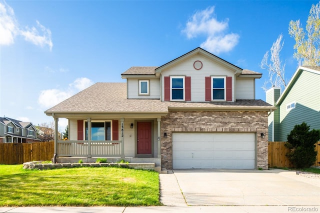 traditional-style house with fence, an attached garage, a front lawn, concrete driveway, and covered porch