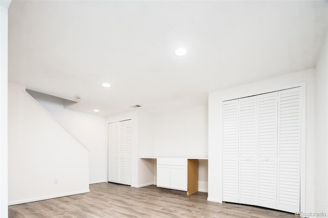 additional living space with recessed lighting, baseboards, visible vents, and wood finished floors