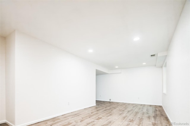 interior space with recessed lighting, baseboards, visible vents, and light wood-type flooring