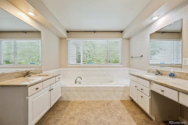 13540 Detroit St, Thornton, CO 80241 - full bathroom featuring two vanities, a garden tub, tile patterned floors, and recessed lighting