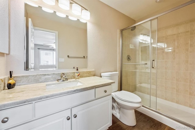 13540 Detroit St, Thornton, CO 80241 - full bath with a stall shower, vanity, wood finished floors, and ceiling fan