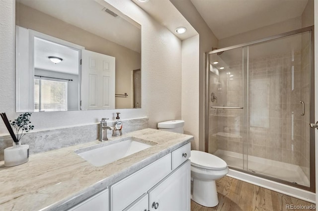 13540 Detroit St, Thornton, CO 80241 - full bath with vanity, a shower stall, and wood finished floors